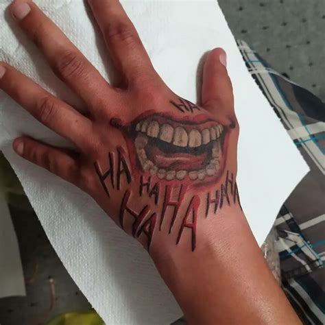 joker mouth tattoo|joker smile hand tattoo drawing.